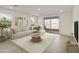 Living room with sliding door to backyard and stylish furnishings at 4961 W Walatowa St, Laveen, AZ 85339