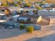 Aerial view of a mobile home on a property with several outbuildings at 49651 W Dune Shadow Rd, Maricopa, AZ 85139