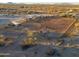 Aerial view of property showing a large arena and surrounding landscape at 49651 W Dune Shadow Rd, Maricopa, AZ 85139