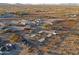 Aerial view of property with a barn, riding arena, and horse stalls at 49651 W Dune Shadow Rd, Maricopa, AZ 85139