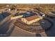 Aerial view of a mobile home with fenced yard and outbuildings at 49651 W Dune Shadow Rd, Maricopa, AZ 85139