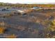 Aerial view of property with arena and desert landscape at 49651 W Dune Shadow Rd, Maricopa, AZ 85139