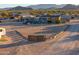 Aerial view of a home with a large yard and wooden fence at 49651 W Dune Shadow Rd, Maricopa, AZ 85139