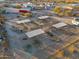 Aerial view of a horse stable with multiple stalls and shade structures at 49651 W Dune Shadow Rd, Maricopa, AZ 85139