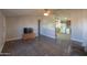 Living room featuring hardwood floors and a view into the kitchen at 49651 W Dune Shadow Rd, Maricopa, AZ 85139