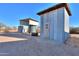 Two metal storage sheds with a covered water tank at 49651 W Dune Shadow Rd, Maricopa, AZ 85139