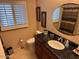 Guest bathroom with granite countertop and oval mirror at 5215 W Acapulco W Ln, Glendale, AZ 85306