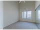 Well-lit bedroom with ceiling fan and mirrored closet doors at 5335 W Bloomfield Rd, Glendale, AZ 85304