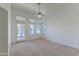 Bright bedroom with door to patio and ceiling fan at 5335 W Bloomfield Rd, Glendale, AZ 85304