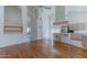 Kitchen with wood cabinets, island, hardwood floors, and stainless steel appliances at 5335 W Bloomfield Rd, Glendale, AZ 85304