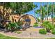 Las Hadas community entrance with a decorative arch and landscaping at 5640 E Bell Rd # 1101, Scottsdale, AZ 85254