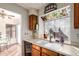 Kitchen with double sink and stained glass window at 5640 E Bell Rd # 1101, Scottsdale, AZ 85254