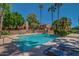 Sparkling community pool with plenty of lounge chairs at 5640 E Bell Rd # 1101, Scottsdale, AZ 85254