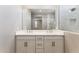 Elegant bathroom with double vanity and marble tile at 5819 E Rose Garden Ln, Phoenix, AZ 85054