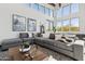 Comfortable seating area in a game room with large windows at 5819 E Rose Garden Ln, Phoenix, AZ 85054