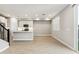 Bright kitchen featuring an island and white cabinets at 5819 E Rose Garden Ln, Phoenix, AZ 85054