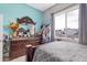 Bedroom with dresser, large window, and decorative mirror at 5830 E Fox Hollow Ln, San Tan Valley, AZ 85140