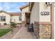 Welcoming entrance with a brick walkway and a stylish front door at 5830 E Fox Hollow Ln, San Tan Valley, AZ 85140