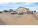 Home's front view showcasing a paved driveway and a gated entrance at 5830 E Fox Hollow Ln, San Tan Valley, AZ 85140