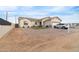 House with a large front yard, driveway, and two-car garage at 5830 E Fox Hollow Ln, San Tan Valley, AZ 85140