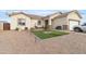 New construction single story home with artificial turf and desert landscaping at 5830 E Fox Hollow Ln, San Tan Valley, AZ 85140