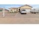 Single-story home with a two-car garage and landscaped front yard at 5830 E Fox Hollow Ln, San Tan Valley, AZ 85140