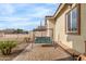 Relaxing patio area with a three-seat swing and brick pavers at 5830 E Fox Hollow Ln, San Tan Valley, AZ 85140