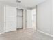 Well-lit bedroom with closet and additional door at 5846 E Ringtail Way, Phoenix, AZ 85054