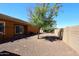 Landscaped backyard with gravel and a tree at 6830 S Crystal Way, Chandler, AZ 85249