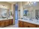 Elegant bathroom with dual sinks, large mirror and garden tub at 6830 S Crystal Way, Chandler, AZ 85249