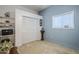 Guest bedroom with closet and built-in shelving at 6830 S Crystal Way, Chandler, AZ 85249