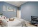 Cozy bedroom with calming blue walls and a comfortable bed at 6830 S Crystal Way, Chandler, AZ 85249