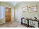 Bright and airy entryway with tile flooring and a stylish console table at 6830 S Crystal Way, Chandler, AZ 85249