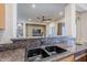 Kitchen sink and granite countertop view of living area at 6830 S Crystal Way, Chandler, AZ 85249