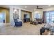 Spacious living room with leather sofas and a large TV at 6830 S Crystal Way, Chandler, AZ 85249