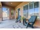 Relaxing screened porch with rocking chairs and view at 6830 S Crystal Way, Chandler, AZ 85249