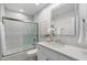 Clean bathroom with a tub, shower, and modern vanity at 7760 E Gainey Ranch Rd # 30, Scottsdale, AZ 85258