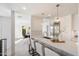 Modern kitchen with white cabinetry and breakfast bar seating at 7760 E Gainey Ranch Rd # 30, Scottsdale, AZ 85258