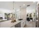 Sleek kitchen with quartz countertops and breakfast bar at 7760 E Gainey Ranch Rd # 30, Scottsdale, AZ 85258