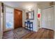 Bright and airy entryway with hardwood floors and a blue console table at 7800 E Lincoln Dr # 1029, Scottsdale, AZ 85250