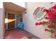 Charming entryway with a blue bench and terracotta tile floor at 7800 E Lincoln Dr # 1029, Scottsdale, AZ 85250