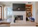 Living room fireplace with tiled surround and built in shelving at 7800 E Lincoln Dr # 1029, Scottsdale, AZ 85250