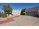 Two-car garage with a reddish-brown paved driveway at 7800 E Lincoln Dr # 1029, Scottsdale, AZ 85250