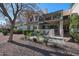 Private patio with seating area and landscaping at 7800 E Lincoln Dr # 1029, Scottsdale, AZ 85250