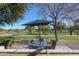 Relaxing patio with seating area and umbrella, overlooking a golf course at 7800 E Lincoln Dr # 1029, Scottsdale, AZ 85250