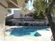 Community pool with lounge chairs and spa at 7800 E Lincoln Dr # 1029, Scottsdale, AZ 85250