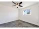 Bright bedroom with ceiling fan and polished concrete floors at 8014 E Oak St, Scottsdale, AZ 85257