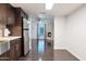 Modern kitchen with stainless steel appliances and dark cabinets at 8014 E Oak St, Scottsdale, AZ 85257