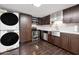 Modern kitchen with stainless steel appliances and dark cabinets at 8014 E Oak St, Scottsdale, AZ 85257