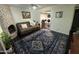 Living area with fireplace, couch and patterned rug at 8014 E Oak St, Scottsdale, AZ 85257